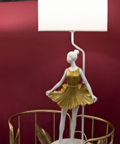 Lampe de table Dancer en métal et résine dorée abat-jour tissu blanc