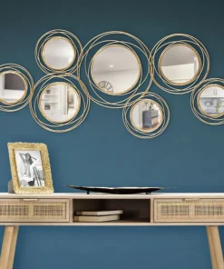 Panneau en métal doré avec cercles et miroirs
